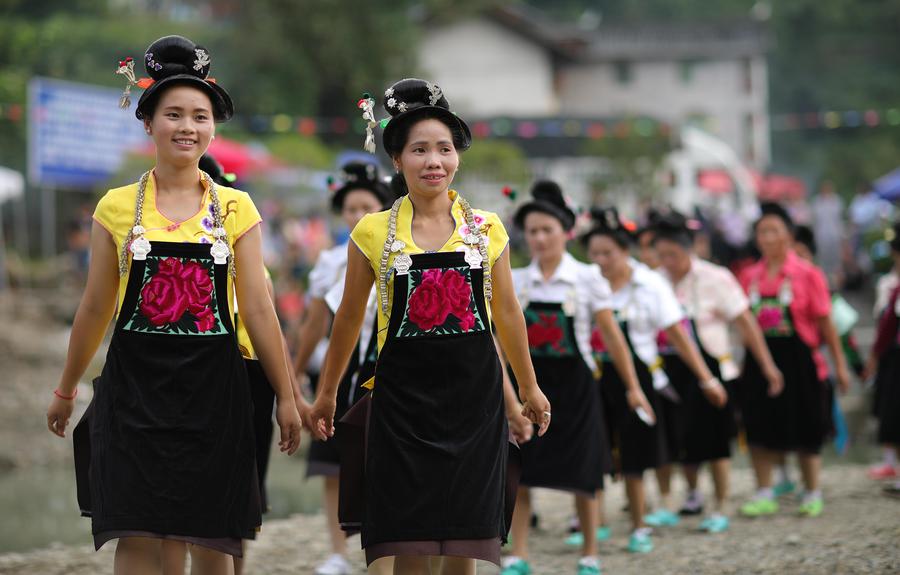 Miao people dance to celebrate 'Chixin Festival' in SW China's Guizhou