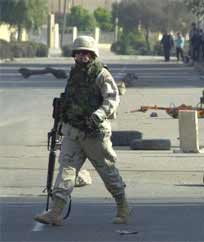 Roadside bomb kills 3 Iraqis, U.S. soldier