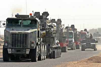 British troops of the 1st Battalion The Black Watch move in a convoy to begin their redeployment to areas near Baghdad October 27, 2004. "The deployment has begun," a spokesman for the Ministry of Defence told Reuters in London. "For operational reasons I can give no further details. But they will be back for Christmas." Squadron Leader Steve Dharamraj told Reuters by telephone from Basra that the movement north involved the Black Watch regiment. [Reuters]