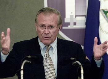 U.S. Secretary of Defense Donald Rumsfeld gestures during a press conference at Presidential House in Managua, November 12, 2004. Rumsfeld began in El Salvador a week-long tour of Latin America, including Nicaragua, Panama and Ecuador, to thank the region for its support of the US-led effort in Iraq and the fight against international terrorism. [Reuters]
