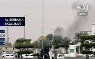 A video still image shows smoke rising from the U.S. Consulate in Jeddah, Saudi Arabia December 6, 2004. The Saudi wing of al Qaeda claimed responsibility for an attack on the heavily fortified U.S. consulate in the Saudi city of Jeddah in which at least nine people died, according to an Internet statement. Photo by Reuters in Jeddah on Monday and arrested two others, security sources said. They said that two more gunmen were being surrounded by the Saudi national guards inside the consulate compound. Attackers had stormed the U.S. mission, killing four Saudi guards and taking 18 local staff hostage, security sources said. 
