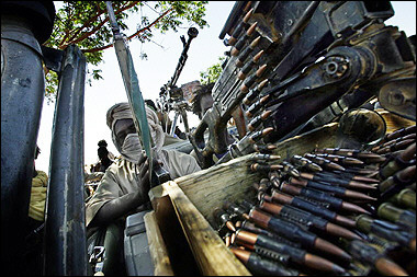 Sudan Liberation Army rebels wait 08 November 2004 in their bases in Gellab, North Darfur, Sudan, during a meeting with Africa Union officers. An African Union spokesman said that the latest reports from the field indicated that fighting was continuing and that someone had shot at an AU helicopter. [AFP/file]