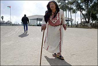 A Palestinian woman leaves the tomb of late Palestinian leader Yasser Arafat in the West Bank city of Ramallah.[AFP]