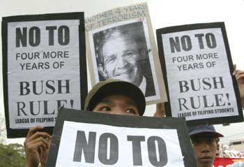 Filipino protesters march towards the U.S. Embassy in Manila January 20, 2005. The anti-U.S. group held a rally outside the U.S. Embassy on Thursday on the occasion of the inauguration of U.S. President George Bush, and condemned the Bush administration for war mongering and human rights violations.