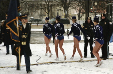 Radio City Rockettes walk backstage in the cold and snow before the color guard during the 'Celebration of Freedom' Inaugural Concert on the Ellipse south of the White House in Washington, DC(AFP/Brendan Smialowski) 