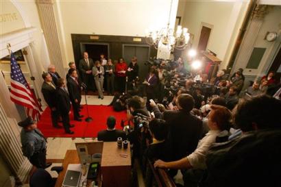 US Massachusetts Gov. Mitt Romney, close to microphone, who skipped President Bush's inauguration to return to the state after learning of a terror threat, speaks during a news conference outside the Statehouse office in Boston, Thursday, Jan. 20, 2005. Romney says there is still no basis for undue alarm or concern over the reports of terror suspects who may be headed for Boston. [AP]