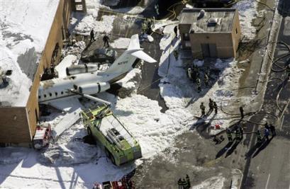 An aerial view of the Canadair Challenger 600 corporate jet that crashed into a building after failing to take off from Teterboro Airport in Teterboro, New Jersey, the USA, Wednesday, Feb 2, 2005. [AP]
