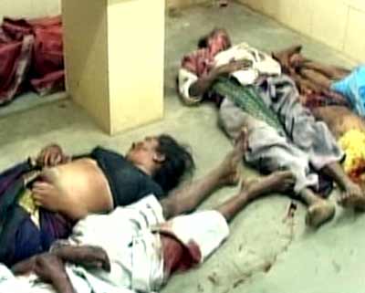A TV grab shows dead bodies of people killed in a train mishap lying inside a hospital in the Indian city of Nagpur, February 3, 2005. At least 52 people were killed when a passenger train collided with a tractor pulling a trailer full of people in central India on Thursday, a railway official said. [Reuters]