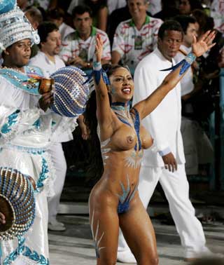 A performer from the Portela samba school dances in Rio de Janeiro's premier Carnival parade February 8, 2005. Carnival started all over Brazil on the weekend, with street parades dominating festivities in the country's large cities in the poor northeast, giving them less of the glitz that has turned Rio's party into a showbiz-like event.