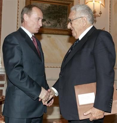 Russian President Vladimir Putin (news - web sites) shakes hands with former U.S. Secretary of State Henry Kissinger during their meeting in the Moscow, Kremlin, Saturday Feb. 12 2005. Putin hosted Henry Kissinger on Saturday during a private visit the former U.S. Secretary of State said was aimed at strengthening ties between the two nations, whose presidents will hold a summit this month. (AP Photo/Yuri Kadobnov, Pool) 