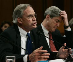 CIA Director Porter Goss, left, with FBI Director Robert Mueller testifies before the Senate Select Committee on Intelligence, during a hearing to examine the global threats against the United States on the Capitol Hill, Wednesday, Feb. 16, 2005 in Washington. [AP]