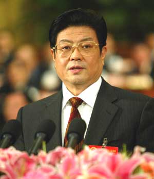 Wang Zhaoguo, vice chairman of the standing committee of the National People's Congress, explains the draft of Anti-Secession Law to NPC deputies in Beijing March 8, 2005. The draft says China will use non-peaceful means to stop secession of Taiwan from China only if all efforts for peaceful reunification prove futile. NPC deputies will deliberate the draft and are likely to adopt it during the third session of the 10th NPC. [newsphoto] 