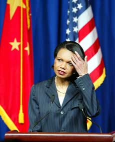 US Secretary of State Condoleezza Rice ponders an answer to a reporter's question at a press conference in Beijing March 21, 2005 before she concluded her China visit. Rice said that the US has no intention to invade North Korea and is committed to the six-party talks for a solution to the nuclear issue. [newsphoto]