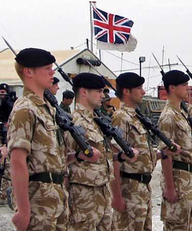 British forces will likely be needed in Iraq until at least 2006, an influential parliamentary committee said on March 24, 2005 in a report that pointed to a series of post-war 'mistakes and misjudgments.' British soldiers stand in formation in the southern Iraqi city of Samawa March 7. [Reuters/file]