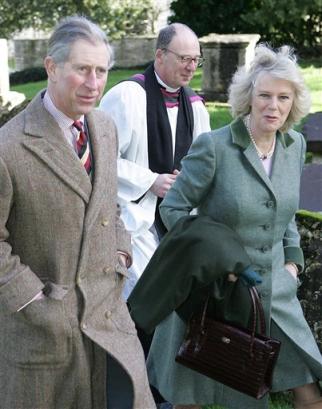 Britain's Prince Charles, the Prince of Wales and his bride-to-be Camilla Parker Bowles are met by Reverend Christopher Mullholland, behind, as they arrive for a Sunday church service St Lawrence's Church in Didmarton, England, in this Sunday, Feb. 13, 2005 file photo. Prince Charles' impending marriage to Parker Bowles has locked public opinion into a contradiction: people largely support the marriage, but don't wish her to be queen. (AP Photo/Tim Ockenden, Pool)