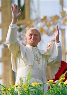 Pope John Paul II waves to a cheering crowd, June 10, 1987, before mass in Krakow during his visit to Poland. The pope was born the son of an army officer, himself the son of a tailor, in a small town near Krakow in southern Poland. [AFP/file]