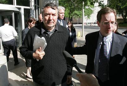 Ludmil Dionissiev, left, a Bulgarian citizen and U.S. resident, leaves the federal courthouse with his attorney David Howard, right, Thursday, April 14, 2005 in Houston. Dionissiev and David Bay Chalmers Jr. were indicted in the United Nations oil-for-food scandal Thursday on charges that they funneled kickbacks to Saddam Hussein with money intended for humanitarian relief. The two were arrested Thursday in Houston as prosecutors in New York announced their indictments. Briton John Irving also was indicted. (AP Photo/David J. Phillip) 