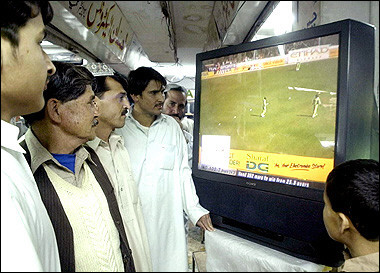 Pakistani men watch a television screen broadcasting the final one day international match between India and Pakistan being played in New Delhi, at a shop in Quetta. Pakistan capped a fairytale fightback with a 159-run victory over India in the sixth and final one-dayer marred by crowd trouble to clinch the series 4-2.(AFP/Banaras Khan)