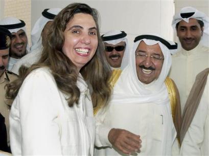 Kuwaiti Women Right's activist Rola Dashti, left, shares a light moment with Kuwait's Prime Minister Sheikh Sabah Al Sabah, right, at the entrance hall of the National Assembly building, Kuwait City after the Parliament session of Tuesday, April 19, 2005. Kuwait's law makers approved in this session a Municipal Council law allowing women to vote and run in the Council's elections. (AP