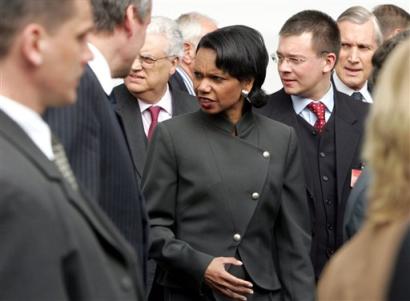 U.S. Secretary of State Condoleeza Rice, center, walks with other NATO foreign ministers prior to a group photo at the Presidential Palace in Vilnius, Thursday April 21, 2005. NATO foreign ministers on Thursday stressed the need to support peace efforts, in particular the Israeli withdrawal from the Gaza strip, but they insisted talking about the Middle East did not signify NATO was preparing for a military engagement in the region. Standing to the left of Rice is Hungarian Foreign Minister Ferenc Somogyi. (AP 