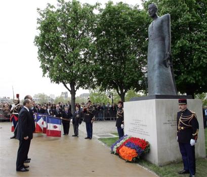 Visiting Armenian President Robert Kotcharian and his French counterpart, Jacques Chirac, background, stand before the Armenian Monument in Paris, after laying a wreath Friday, April 22, 2005. This weekend Armenia marks the 90th anniversary of what it calls the genocide perpetrated by Turkey between 1915 and 1917, killing up to 1.5 million Armenians. Turkey rejects the claim, saying the number of deaths is inflated and that the victims were killed in civil unrest during the collapse of the empire.(AP