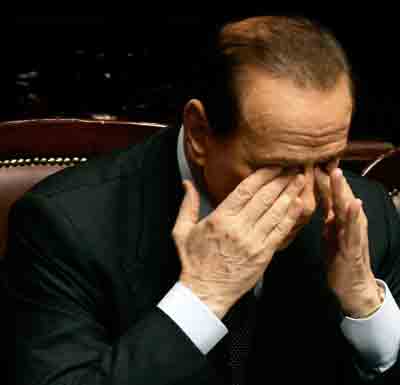 Italian Prime Minister Silvio Berlusconi reacts in a parliamentary session in Rome April 26, 2005. [Reuters]