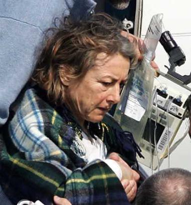 Former hostage Giuliana Sgrena, saved by an Italian agent killed when U.S. troops in Iraq opened fire on their car, branded a report clearing the soldiers of blame a 'slap in the face for the Italian government' on April 26, 2005. Sgrena arrives at Ciampino airport in Rome, March 5, 2005. (Max Rossi/Reuters