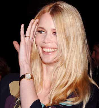 German model-actress Claudia Schiffer smiles during the premiere of new film "Layer Cake" at the Egyptian Theatre in Los Angeles May 2, 2005. The film is directed by her husband Matthew Vaughn. [Reuters]