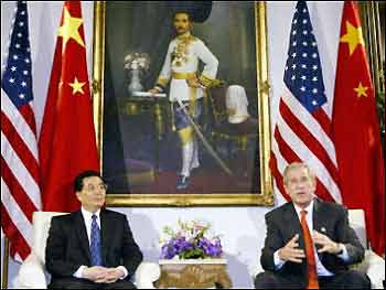 China's President Hu Jintao and US President George W. Bush (R) speak to the press in Bangkok before the 2003 Asian Pacific Economic Cooperation meetings in Bangkok, Thailand.
