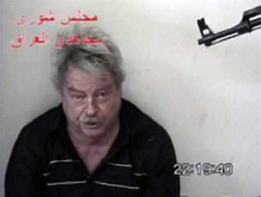 A video grab from a tape delivered by militants to news agencies on May 1, 2005 shows 63-year-old Australian hostage Douglas Wood at an undisclosed location in Iraq. Australia has appealed on Al Jazeera television for the release of Wood, saying he has a serious heart problem and wants to be reunited with his wife and child. (Staff/Reuters) 