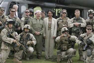 U.S. Secretary of State Condoleezza Rice, center-right, poses with Kurdish leader Massoud Barzani, center-left, and U.S. Army soldiers in the northern city of Irbil during a brief visit to Iraq Sunday, May 15, 2005. 