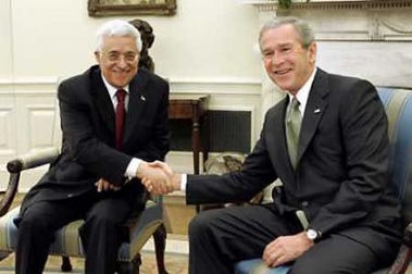 U.S. President George W. Bush meets with Palestinian President Mahmoud Abbas (L) in the Oval Office of the White House, May 26, 2005. (Kevin Lamarque/Reuters)