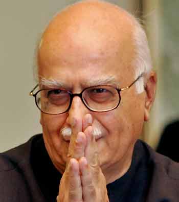 Indian opposition leader Lal Krishna Advani makes a Hindu-style greeting before leaving the prime minister house in Islamabad May 31, 2005. [Reuters]