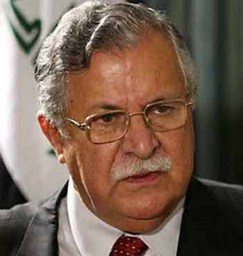 Iraqi President Jalal Talabani listens during an interview with Reuters in Amman May 8, 2005.