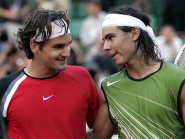 Top-seeded Switzerland's Roger Federer, left, smiles to Spain's Rafael Nadal after their semifinal match of the French Open tennis tournament, at the Roland Garros stadium, Friday June 3, 2005 in Paris. Nadal won 6-3, 4-6, 6-4, 6-3. (AP 