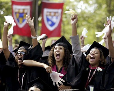 graduates cheer at the harvard university commencement