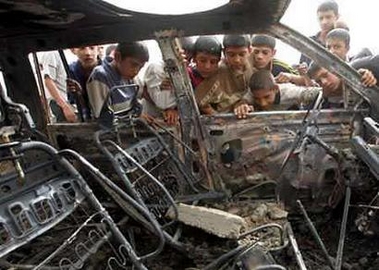 U.S. air strikes killed an estimated 40 insurgents in western Iraq on June 11, 2005, the military said, but in Baghdad a suicide bomber attacked the headquarters of an elite police unit, killing three. Children look inside a car after a suicide car bomb attack in Baghdad. A car bomb exploded on a street in a Shi'ite area of Baghdad Friday night, killing 11 people and wounding 29, police and hospital officials said.