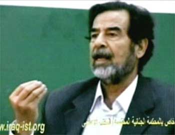 In this image made from video provided by the Iraqi Special Tribunal on Monday, former Iraqi President Saddam Hussein speaks during questioning by magistrates at an unspecified location and date. (AP