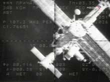 The International Space Station is seen from a Russian cargo ship, the unmanned Progress M-53 spacecraft, which makes its slow approach on Sunday, June 19, 2005, in this image from the television provided by Russian Mission Control. A Russian cargo ship successfully docked with the international space station Sunday, delivering supplies and equipment for its U.S. and Russian crew, Russian Mission Control said.(AP