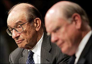 US Federal Reserve Board Chairman Alan Greenspan(L) and US Treasury Secretary John Snow testify before the Senate Finance Committee on Capitol Hill in Washington, DC. They warned lawmakers worried about China not to retreat to 'protectionism.'(AFP