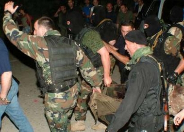 Georgian special police servicemen detain a man suspected of throwing a grenade during a speech by visiting U.S. President George W. Bush in May, in Tbilisi, July 20, 2005.