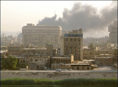Black smoke fills the sky following car bombings in central Baghdad