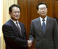 Chinese Vice Foreign Minister Wu Dawei, right, shakes hands with Kim Yong Il, vice minister of North Korean's Foreign Ministry, in Pyongyang, North Korea's capital, on Sunday August 28, 2005. Wu Dawei is leading a delegation from the Chinese Foreign Ministry to visit the North to discuss resuming six-party talks on disarming Pyongyang's nuclear program. 