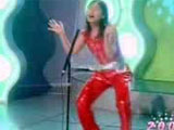 Huang Xin from Sichuan Province, known as the "red-dressed patriarch" sends shocking waves by her debute on the "Super Girl" stage.