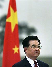 Chinese President Hu Jintao listens to the national anthem during a welcome ceremony inside the Great Hall of the People in China's capital Beijing August 30, 2005.