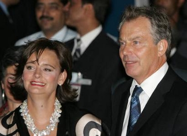 British Prime Minister Tony Blair (R) and his wife Cherie arrive at the airport in New Delhi Sept. 6, 2005. Blair is in India on a two-day visit. 