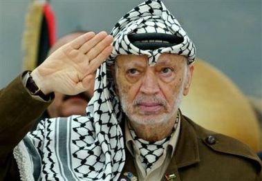 Palestinian leader Yasser Arafat salutes while attending a conference at his compound in the West Bank town of Ramallah, in this Tuesday, Aug. 10, 2004 file photo. 