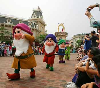 Disney's characters Seven Dwarfs perform during the "Disney On Parade" show at Hong Kong Disneyland September 11, 2005, a day before the grand opening of the theme park. Disney officially opens its new Hong Kong theme park on Monday, bringing a slice of the Magic Kingdom to the Middle Kingdom with a careful blend of American showmanship and Chinese characteristics. [Reuters]