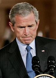 President Bush reacts during a joint press availiblity with Iraqi President Jalal Talabani, Tuesday, Sept. 13, 2005, in the East Room at the White House in Washington.