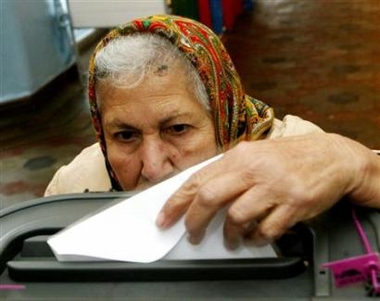 An elderly Azeri woman casts her ballot at a polling station in the village of Balakhany, 15 km (9 miles) east of the capital Baku, November 6, 2005.